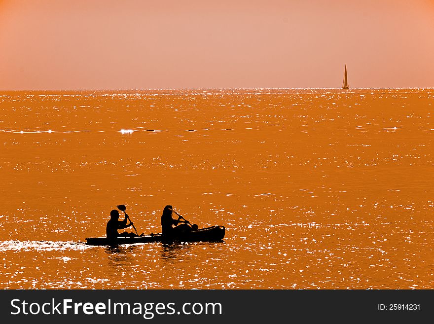 Couple Kayaking At Dusk