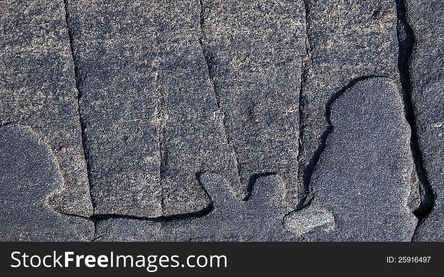 Shapes and cracks on granite stone in rural scene. Shapes and cracks on granite stone in rural scene