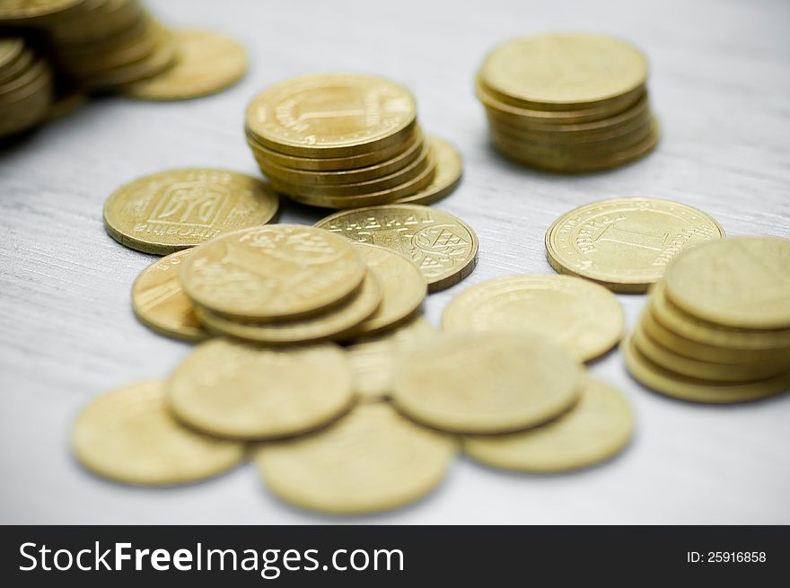 On a white background the scattered coins. On a white background the scattered coins