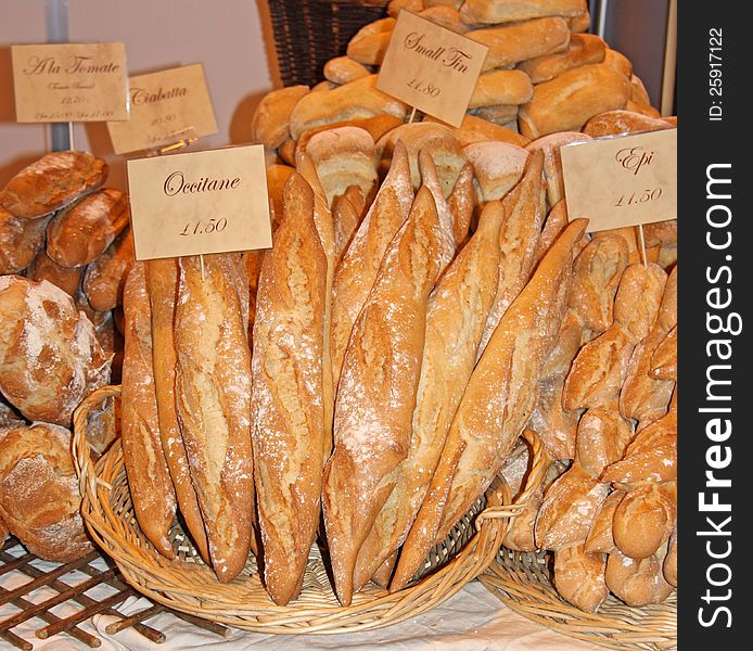 A Display of Various Fresh Bread Loaves for Sale. A Display of Various Fresh Bread Loaves for Sale.