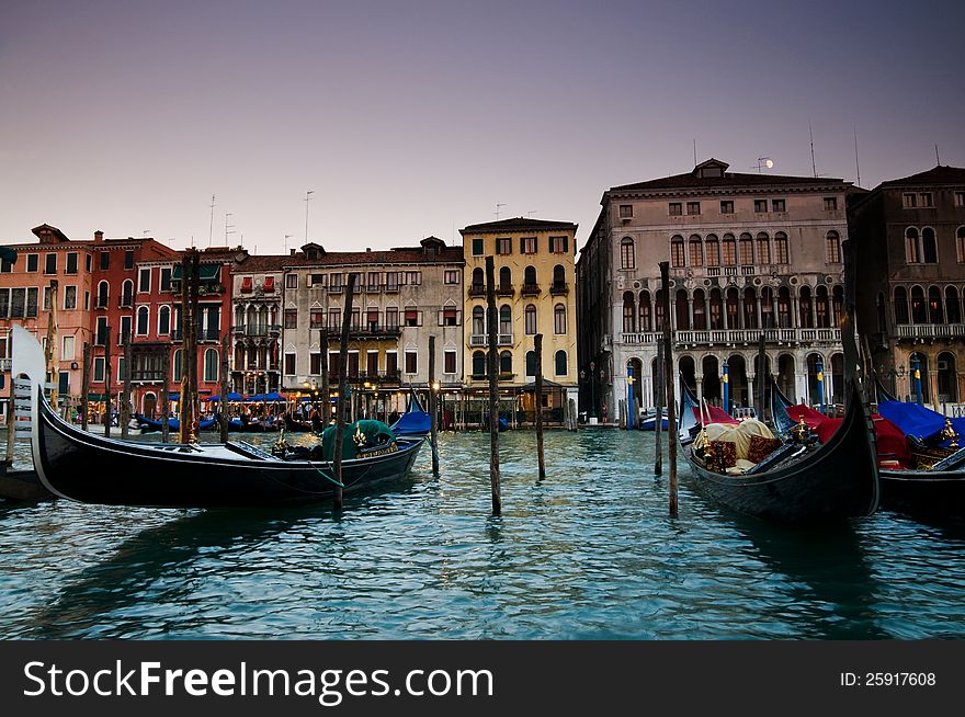 Famous gondolas of Venice moored in the grand canal in front of venican architecture. (79). Famous gondolas of Venice moored in the grand canal in front of venican architecture. (79)