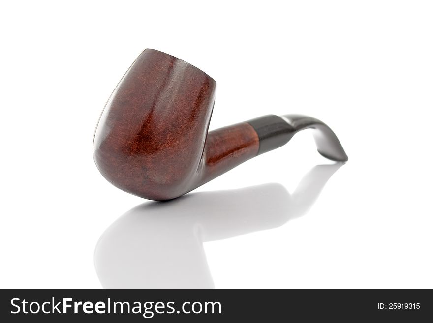 Tobacco pipe with reflection isolated on white background. Tobacco pipe with reflection isolated on white background