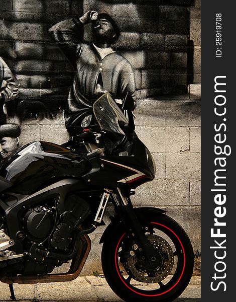 A sleek black motorcycle with glowing red markings and white stripes. A sleek black motorcycle with glowing red markings and white stripes.