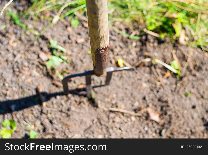 Pitchfork stuck in the ground