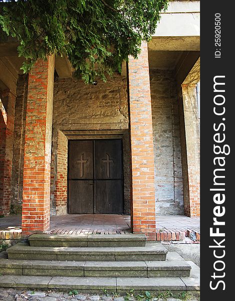 Mysterious medieval church door and brick pillars. Mysterious medieval church door and brick pillars.