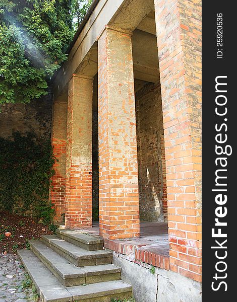 Mysterious medieval church entrance and brick pillars. Mysterious medieval church entrance and brick pillars.