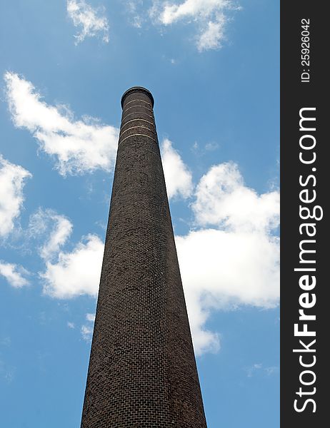 Old industrial brick chimney stack. Old industrial brick chimney stack