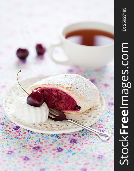 Strudel with cherries and almonds, selective focus. Strudel with cherries and almonds, selective focus