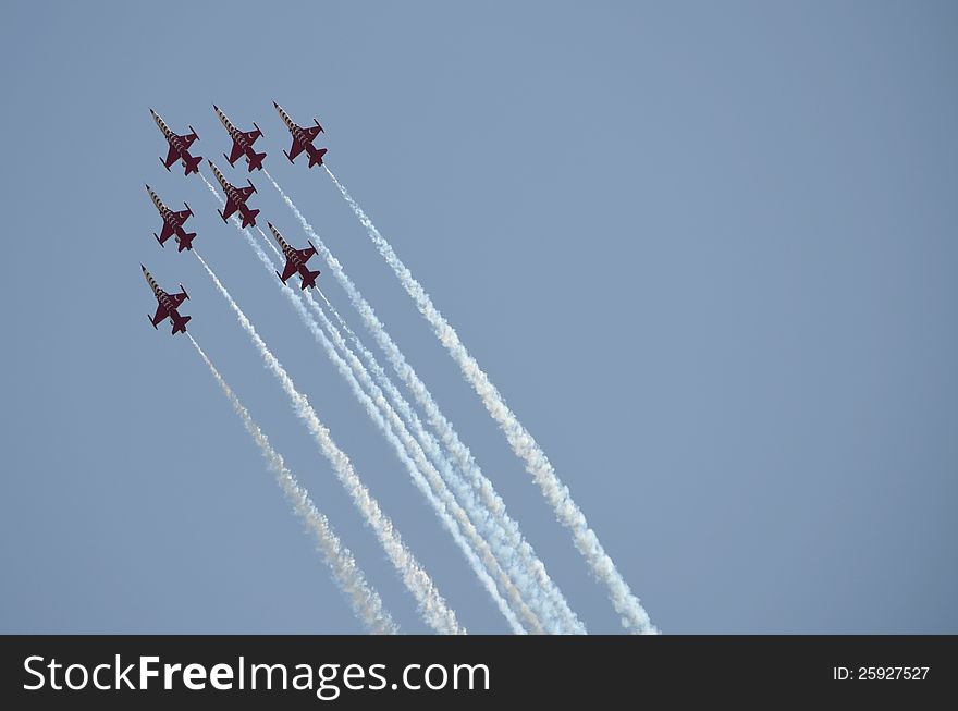 Aircrafts demonstrating acrobatics on an Air Show