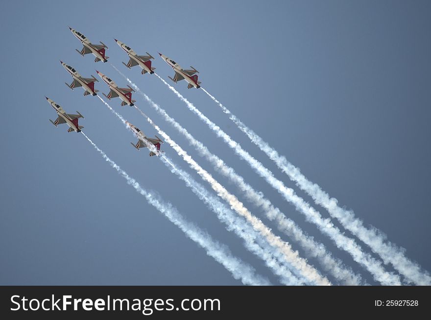 Aircrafts demonstrating acrobatics on an Air Show