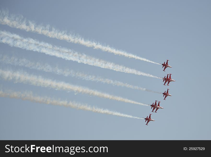 Aircrafts demonstrating acrobatics on an Air Show