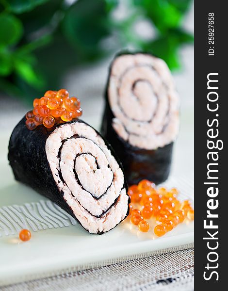 Salmon and nori roll, selective focus. Salmon and nori roll, selective focus