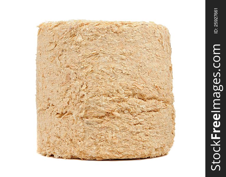 A compressed sawdust fire log on a white background