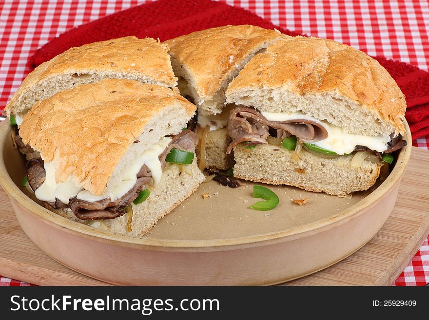 Baked roast beef sandwiches in a baking dish