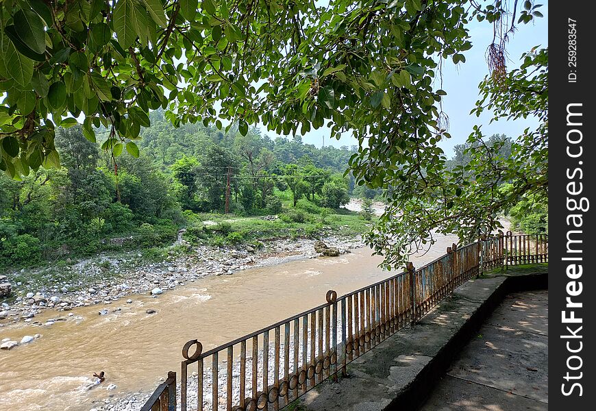 view of a muddy stream in rural landscape