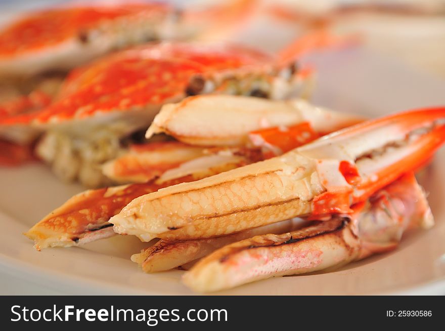 Boiled crab peeled-claw on plate. Boiled crab peeled-claw on plate