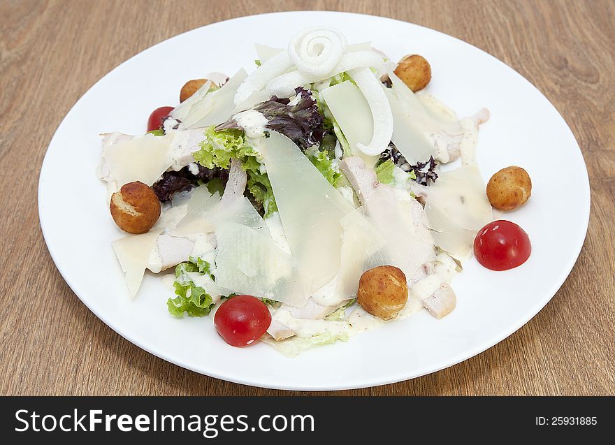 Salad with vegetables, meat and cheese