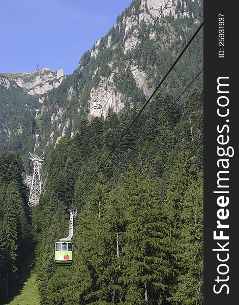 A cable car riding along one of the Bucegi mountains valley, Romania