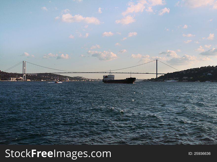 Ship moving under Bosphorus bridge. Istanbul, Tuskey. Ship moving under Bosphorus bridge. Istanbul, Tuskey