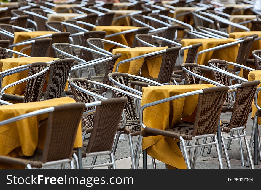 Image of a empty yellow terrace in a city street. Image of a empty yellow terrace in a city street.