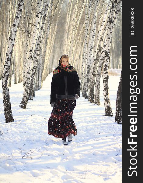 Russian beauty in the winter birch forest