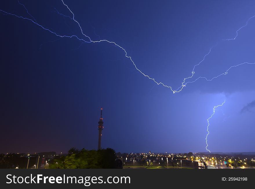 Horizontal and vertical lightning near telecommunications tower. Horizontal and vertical lightning near telecommunications tower