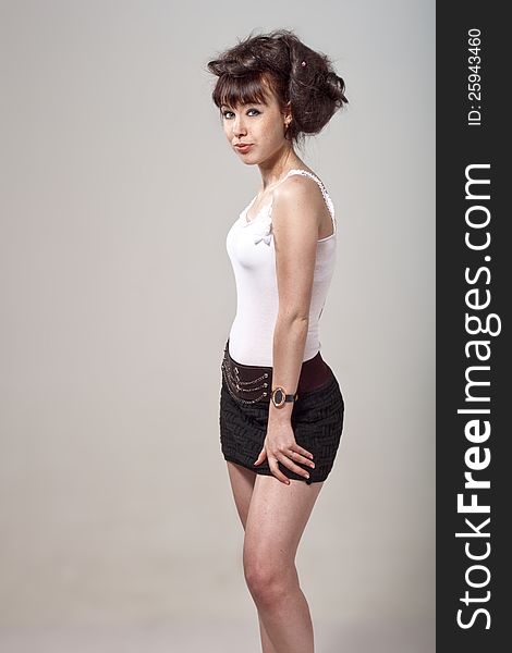 Beautiful girl with disheveled hair and a black skirt. Beautiful girl with disheveled hair and a black skirt