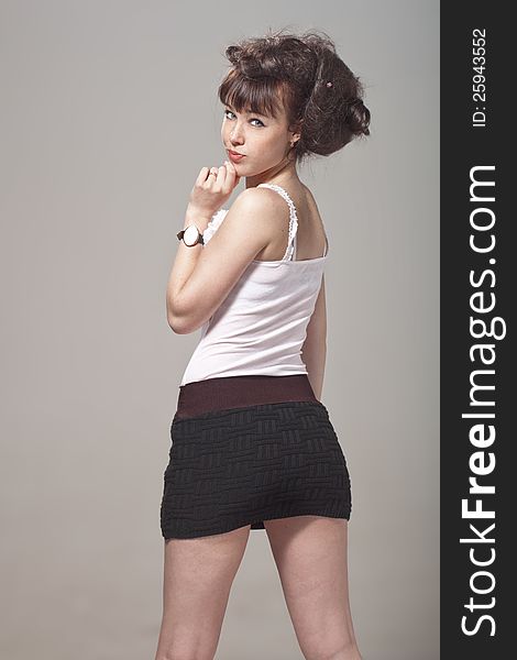 Beautiful girl with disheveled hair and a black skirt. Beautiful girl with disheveled hair and a black skirt