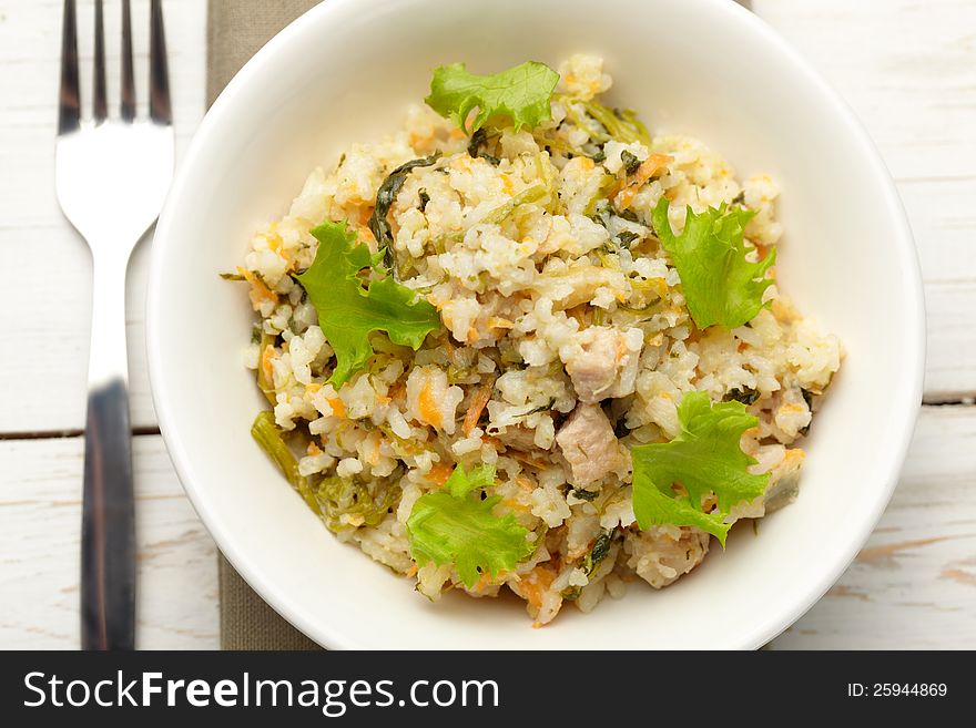 Rice with pork, carrots and spinach
