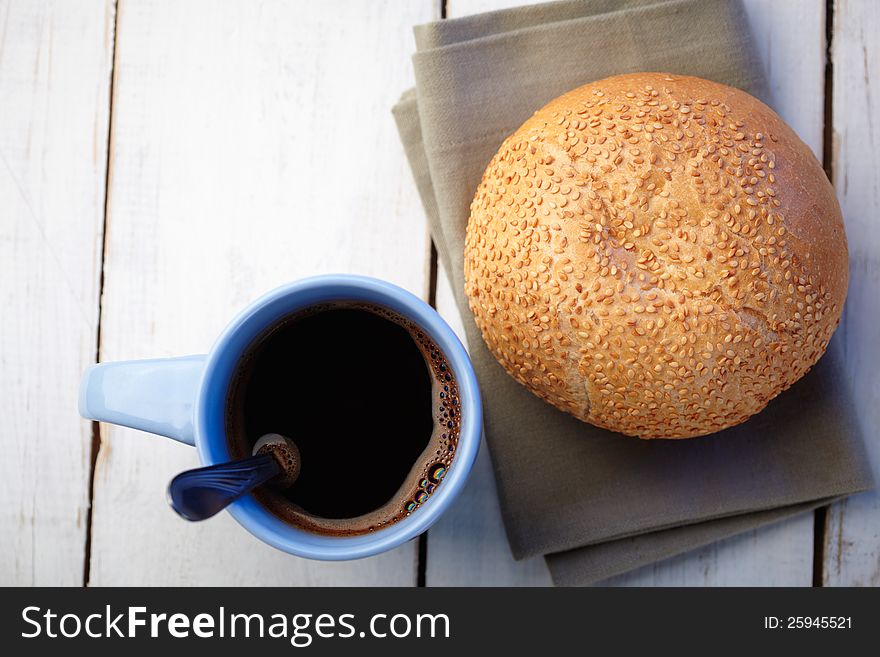 Coffee and loaf with sesame