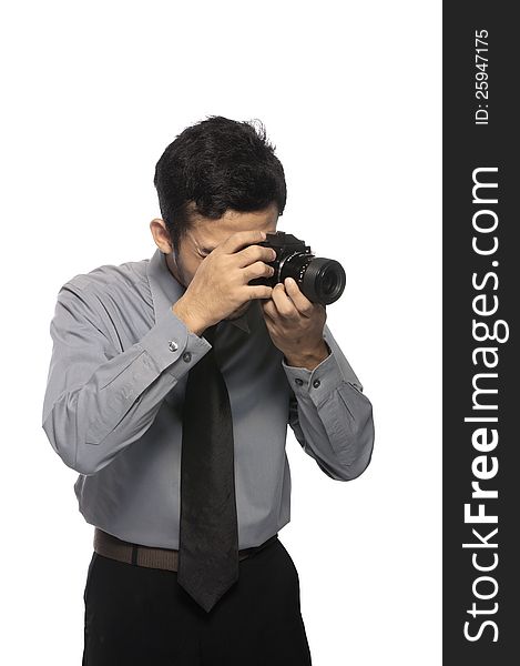 Photographer wearing shirt and tie take photo isolated over white background. Photographer wearing shirt and tie take photo isolated over white background