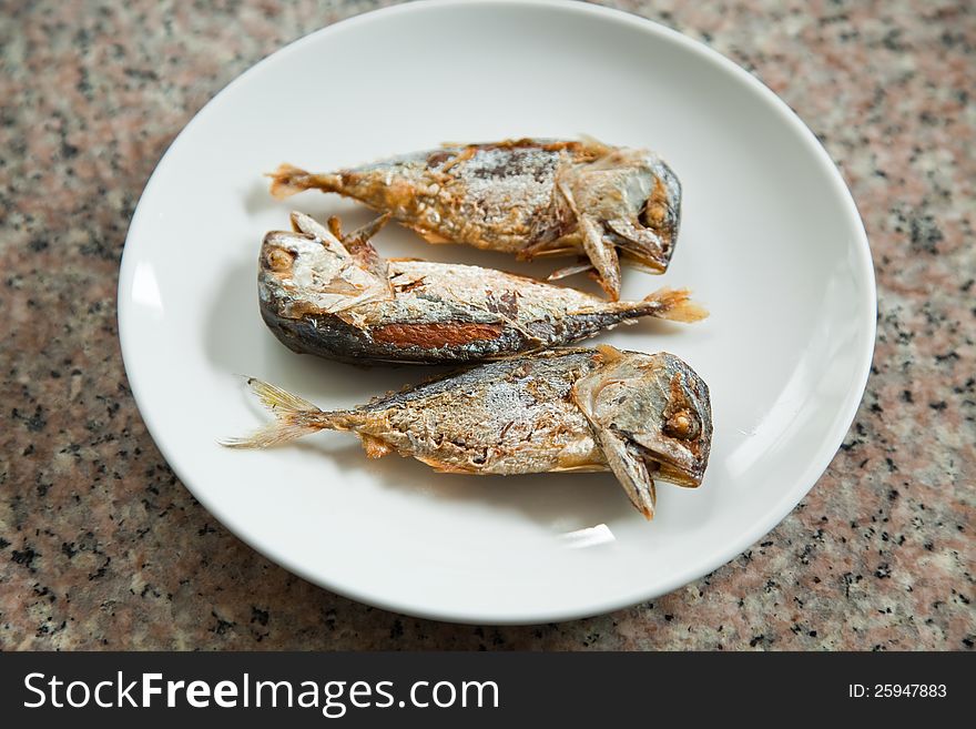 FRIED MACKEREL ON THE WHITE PLATE