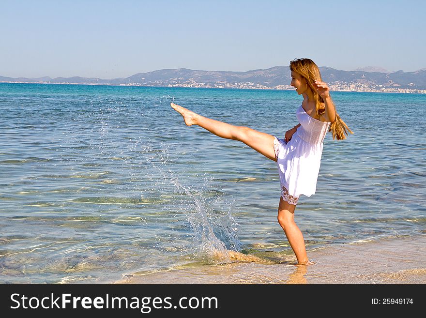 Happy Young Beautiful Woman  On The Beach