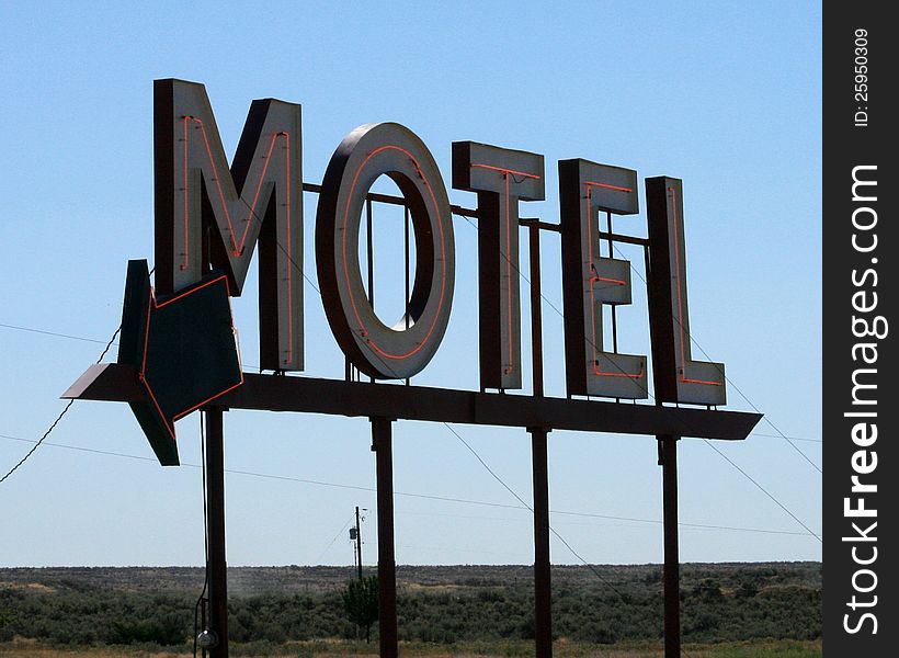 Lighted motel here sign with arrow. Lighted motel here sign with arrow