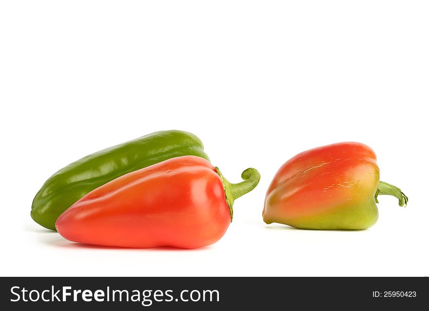 Close-up of fresh bell peppers on white background.