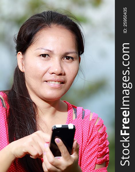 Women using smartphone In the park