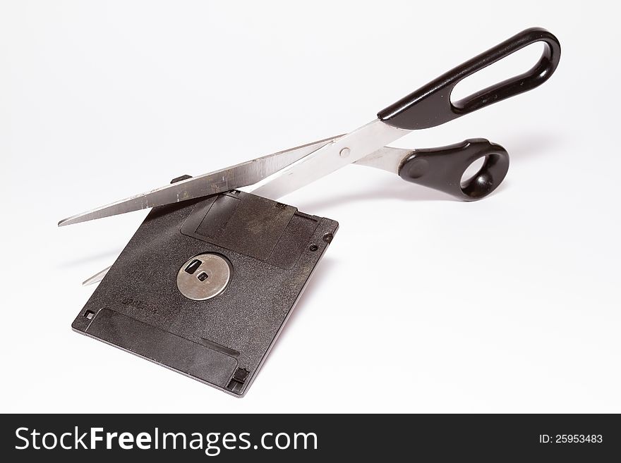 Image of black diskette and scissors