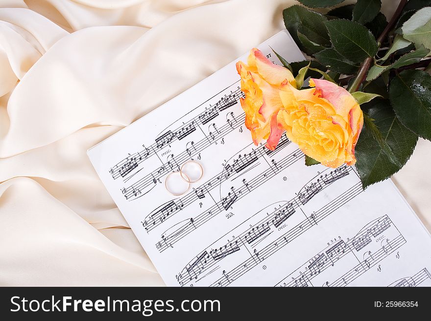 Bouquet Of Roses, Wedding Rings On Silk