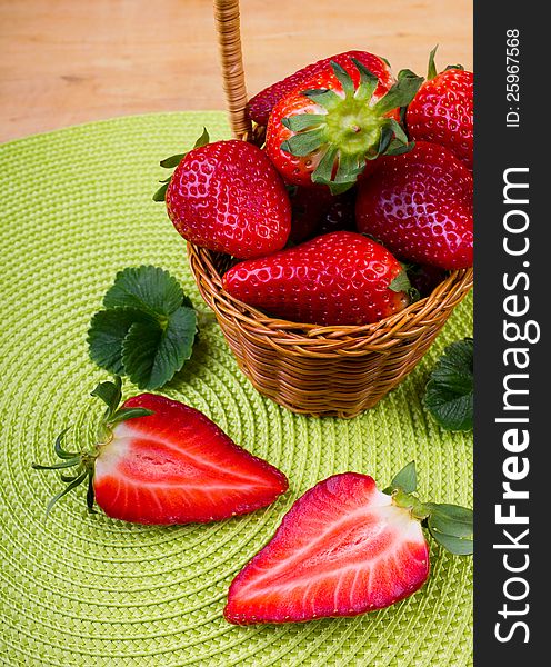 Fresh strawberry in the basket on the wooden table