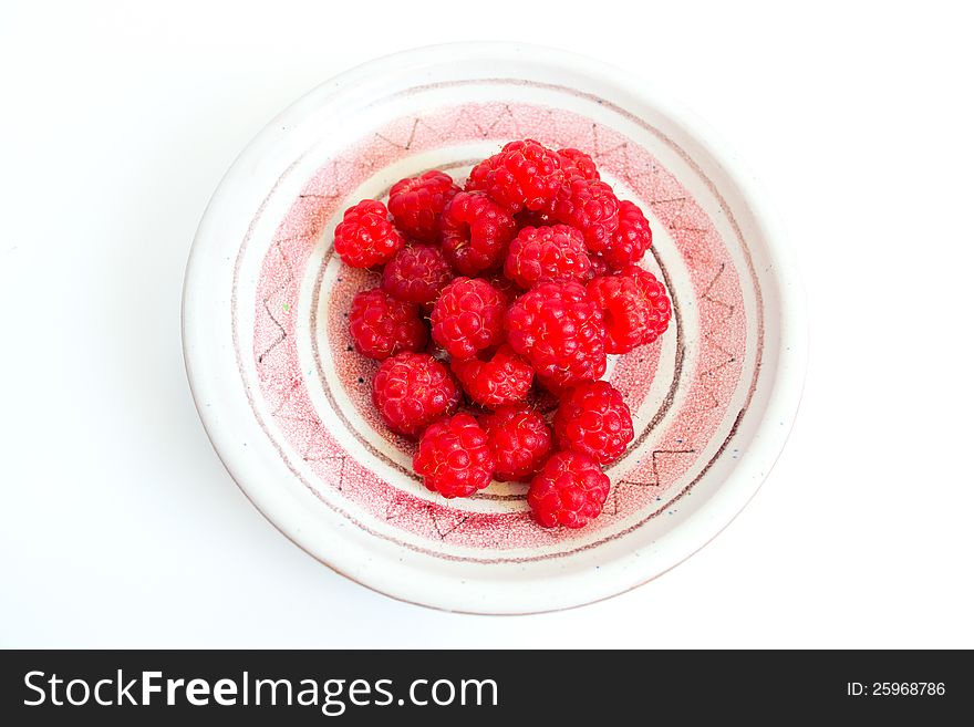 Wild raspberries on a clay dish. Wild raspberries on a clay dish