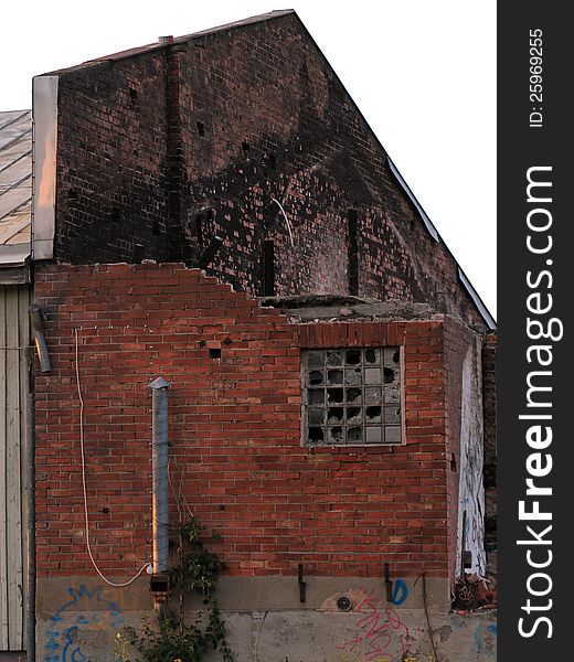 Abandoned and partly teared down brick house isolated with white background. Abandoned and partly teared down brick house isolated with white background