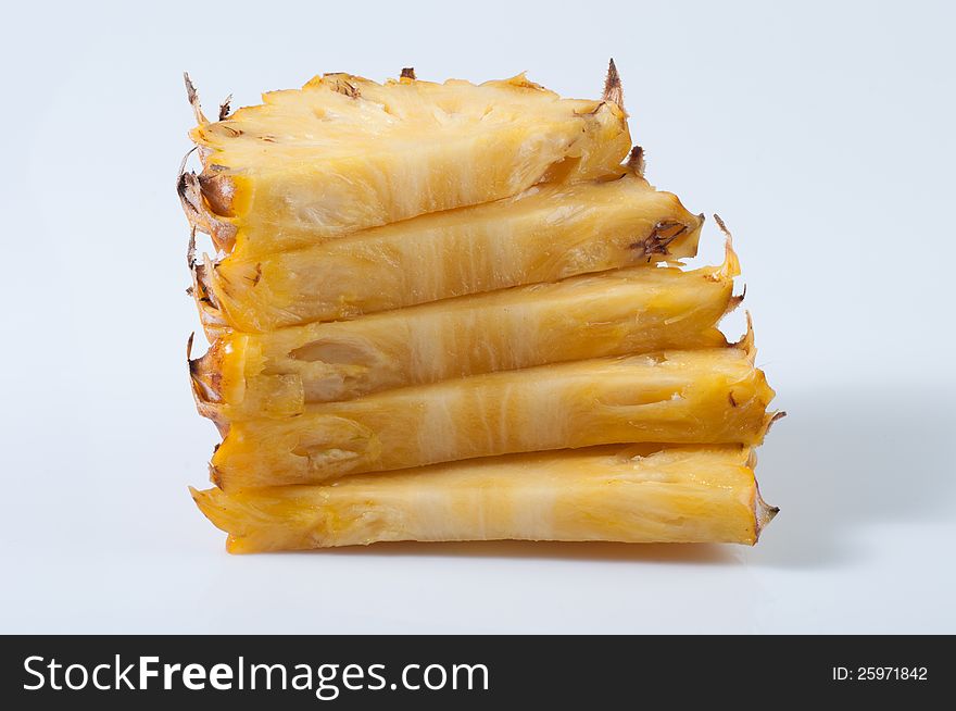 Pineapple section and slices on white background