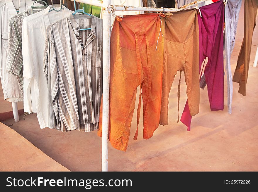 Various of shirts and pants for men at flea market in India. Various of shirts and pants for men at flea market in India