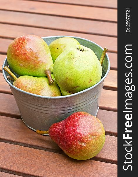Fresh Colourful Pears In Bowl On Wooden Backgro