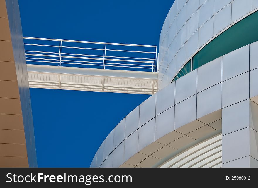 Abstract view of modern buildings against bright blue, cloudless sky. Abstract view of modern buildings against bright blue, cloudless sky