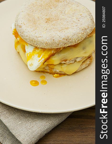 English muffin with sausage, egg and cheese