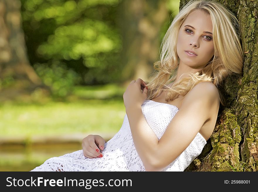 Beautiful blond sensuality woman in the garden. Beautiful blond sensuality woman in the garden