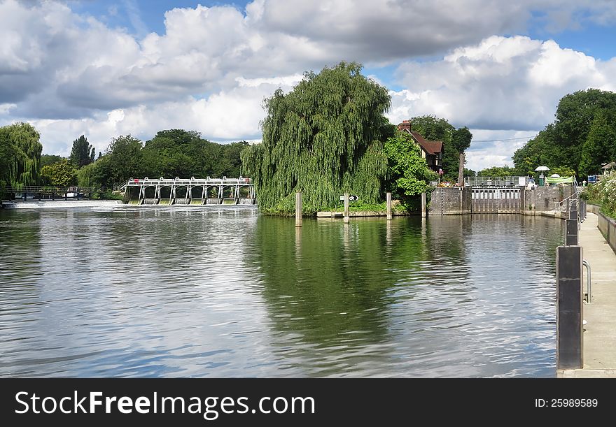 Weir and sluice on the River Thames in England. Weir and sluice on the River Thames in England