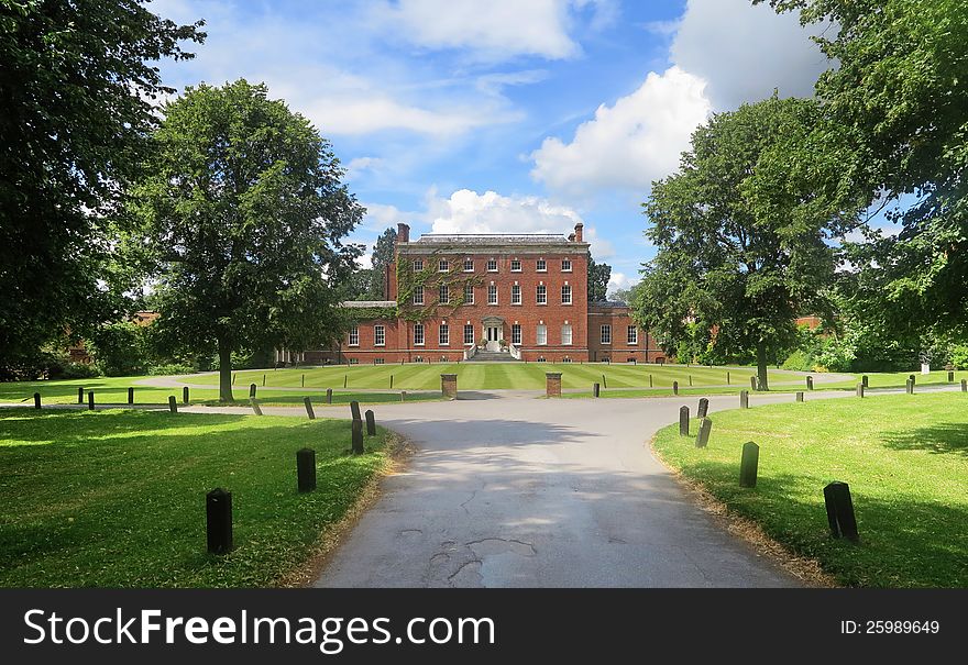 An English Stately Home with Mullion Windows viewed from the front Lawn. An English Stately Home with Mullion Windows viewed from the front Lawn