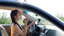 Female Driver Applying Make-up Stock Photos Female Driver Applying Make-up Stock Photos